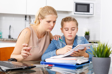 Woman supporting her upset daughter