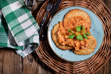 Homemade potato pancakes with goulash.