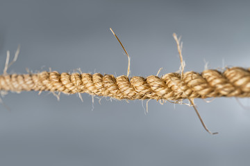 Rough strong rope on gray background