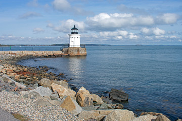 Fototapeta na wymiar Small, white, steel lighthouse whose seams are disguised as corinthian columns, viewed from Bug Light Park in Cape Elizabeth, Maine -02