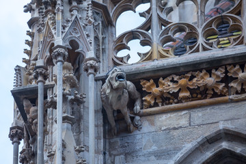 Elements of Gothic architecture. Grotesque, chimera and gargoyle sculptures on the facade of an...