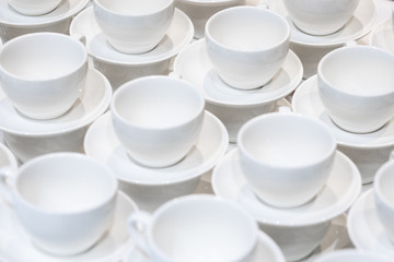 A lot of white cups for coffee. Catering.