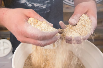 Ground barley in container, grinding barley.