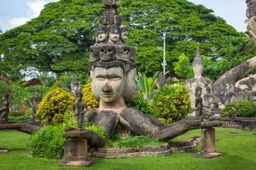 Buddha park Xieng Khouane in Vientiane, Laos. Famous travel tourist landmark of Buddhist stone statues and religious figures.