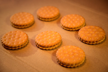 homemade, shortbread, milk cookies as a gift on a wooden background, with a rope