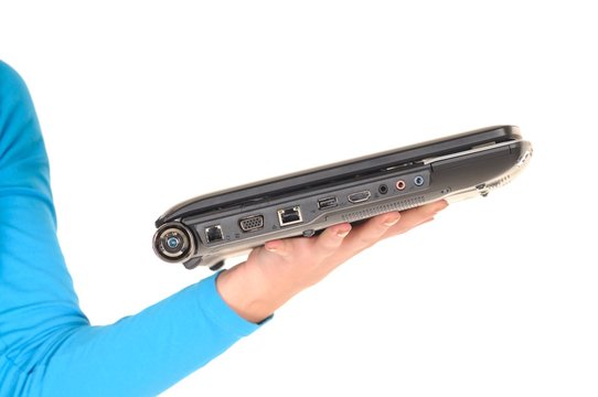 Light modern laptop on girl hand