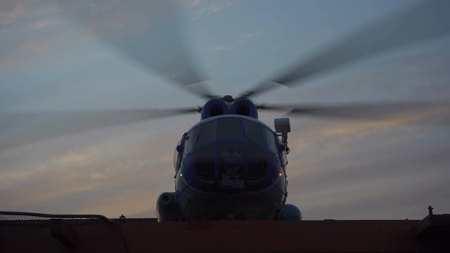 helicopter MI 8 takes off from the ship