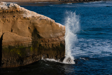 big waves crashing on the rocks