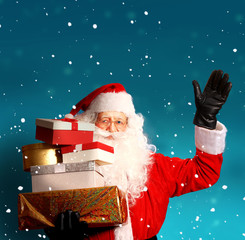Santa claus with gift boxes.Merry Christmas and happy New Year greeting card 