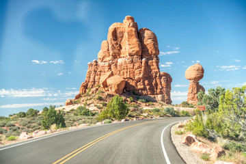 Road across the nature on a beautiful summer day, Arches National Park, Utah
