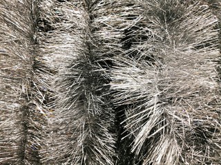 Beautiful tinsel, great design for any purposes. New year card. Bright tinsel, Christmas background, shiny pattern. Colorful decoration.