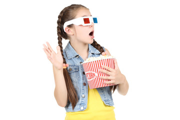 Beautiful young girl in 3d glasses holding bucket with popcorn on white background