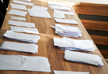 Sheets of paper collected during a poll, referendum, questionnaire or election, with the wishes of...