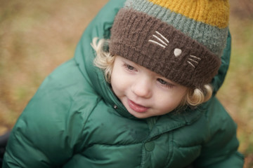 Happy 2 years old child closeup portrait at autumn park