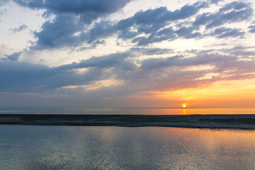 Fototapeta na wymiar Beautiful orange sunset over the sea.