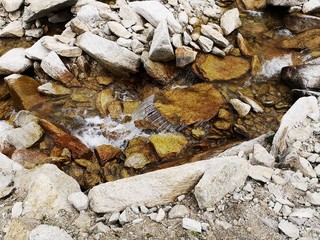 River flows over rocks 