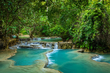 Turquoise water of Kuang Si waterfall, Luang Prabang, Laos. Tropical rainforest. The beauty of nature.