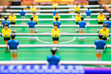 Foosball table soccer. Sport teame football players. Mini football table. Tabletop soccer table