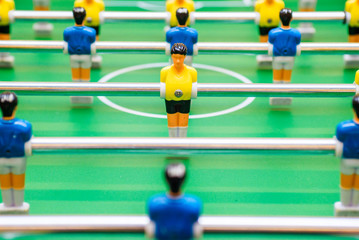Foosball table soccer. Sport teame football players. Mini football table. Tabletop soccer table