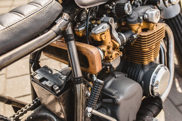 Fototapeta na wymiar Close up detail of a powerful vintage motorcycle - large carburetor engine