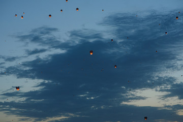 Flying lantern in the dark sky