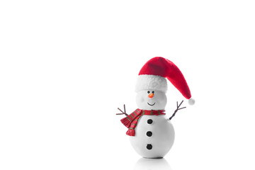 Snowman toy in Santa Claus hat isolated on white background