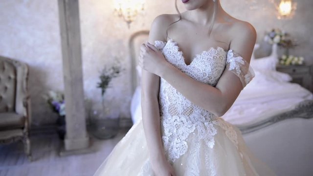 beautiful bride posing on camera in the interior