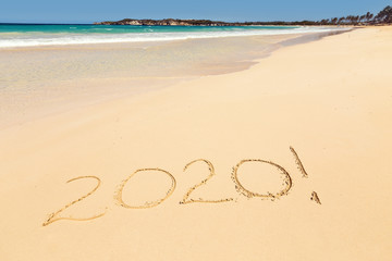 Inscription 2020 on sandy beach