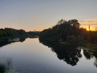 Naklejka na ściany i meble River view at sunset
