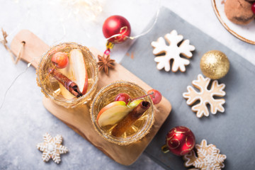 Christmas Spicy Apple Cider  or  punch beverage. Seasonal mulled Traditional autumn, winter drinks and cocktails with apple, cinnamon, anise.