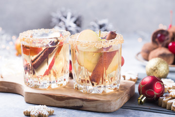 Christmas Spicy Apple Cider  or  punch beverage. Seasonal mulled Traditional autumn, winter drinks and cocktails with apple, cinnamon, anise.