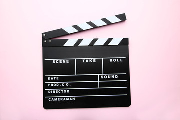 Clapper board on pink background