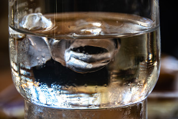glass of water with ice on a background