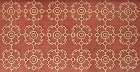 abstract geometric circles design pattern on red background in a red wall