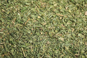 Heap of dried parsley as background, closeup