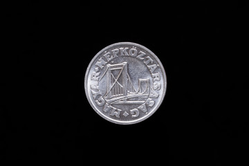 Old Hungarian 50 Filler coin from 1985, obverse showing Elisabeth Bridge in Budapest. Isolated on black background