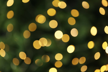 Abstract background with blurred yellow Christmas lights, bokeh effect