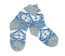 Knitted socks on white background, top view