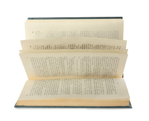 Open hardcover old book on white background