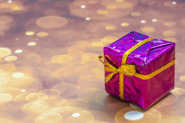 Christmas concept. One wrapped gift box with ribbon.
