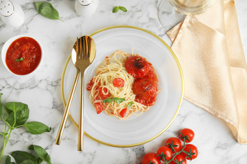 Flat lay composition with tasty pasta on white marble table