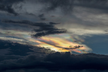 Fototapeta na wymiar Cloud iridescence phenomenom at sunset over the central Andean mountains of Colombia.