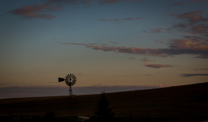 Fototapeta na wymiar Steel windmill at sunset in Palouse