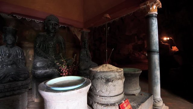Tourists walk through caves at Bich Dong Pagoda, Tam Coc, Vietnam