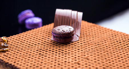 chocolate macaron cake with brownies in topping