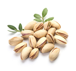 Tasty pistachio nuts on white background