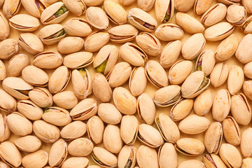 Tasty pistachio nuts as background