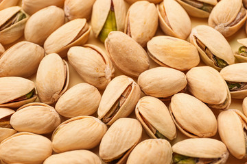 Tasty pistachio nuts as background