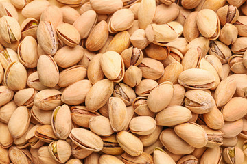 Tasty pistachio nuts as background