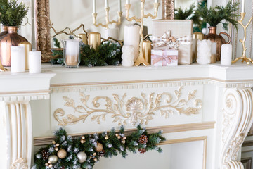 Christmas morning. Classic luxurious apartments with decorated christmas tree and presents. Living with fireplace, columns and stucco.